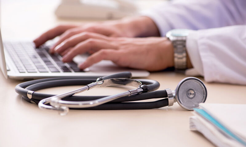 bigstock-Young-male-doctor-in-telemedic-294148495