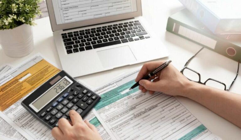 Polish individual income tax return. Accountant working with Polish tax forms